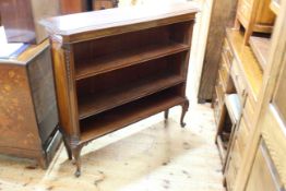 Mahogany shaped top open bookcase on cabriole legs with two adjustable shelves,