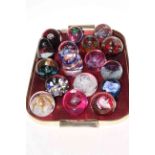 Collection of seventeen glass paperweights including several Caithness Glass.