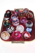 Collection of seventeen glass paperweights including several Caithness Glass.