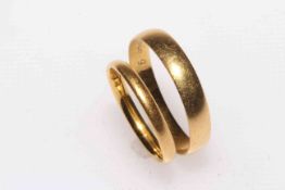 Two 22 carat yellow gold wedding bands.