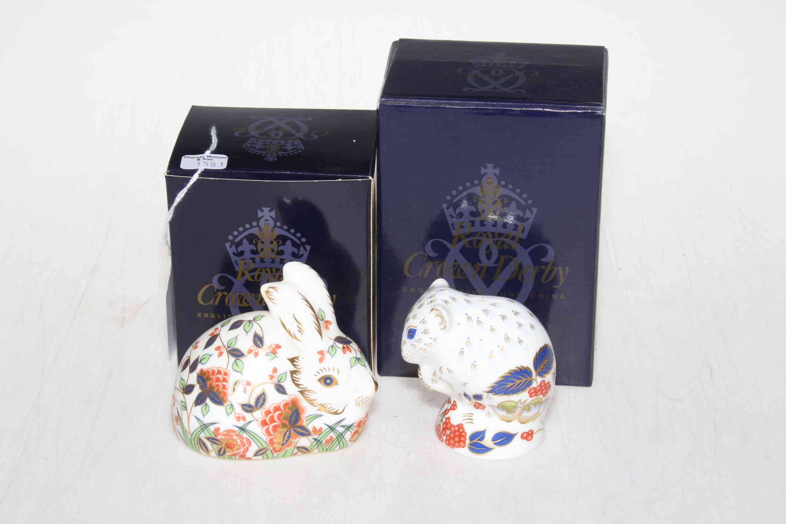 Two Royal Crown Derby paperweights, Meadow Rabbit and Derby Dormouse, in boxes.