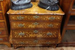 Dutch marquetry four drawer serpentine front chest inlaid with floral garlands,