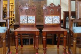 Pair Victorian mahogany hall chairs with Minton? tiled inset backs.