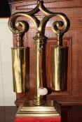 Brass dinner gong, 78cm high.