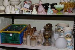 Collection of advert stoneware and glass bottles, three Victorian oil lamps, Falcon Ware pottery,