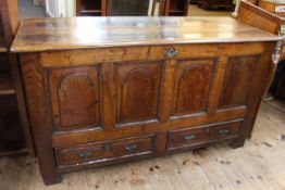 Antique oak quadruple arched panel front mule chest with two base drawers, 78cm by 138cm by 52cm.