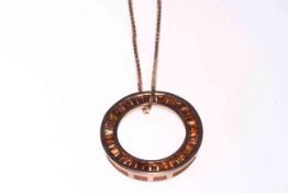 Red Diamond circular pendant and chain set in 9 carat yellow gold.