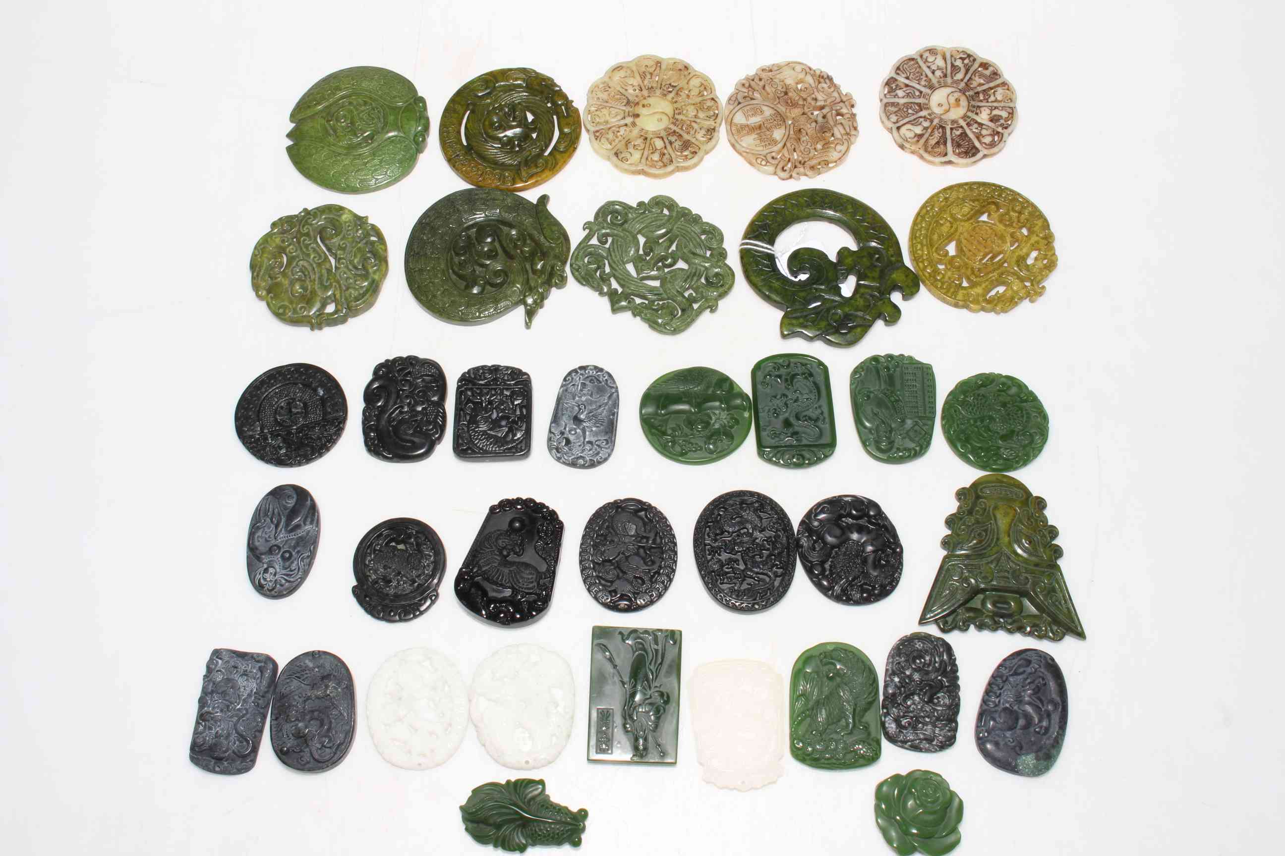 Collection of Chinese jade and other roundels.