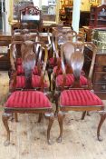 Set of eight walnut Queen Anne style dining chairs including pair carvers.