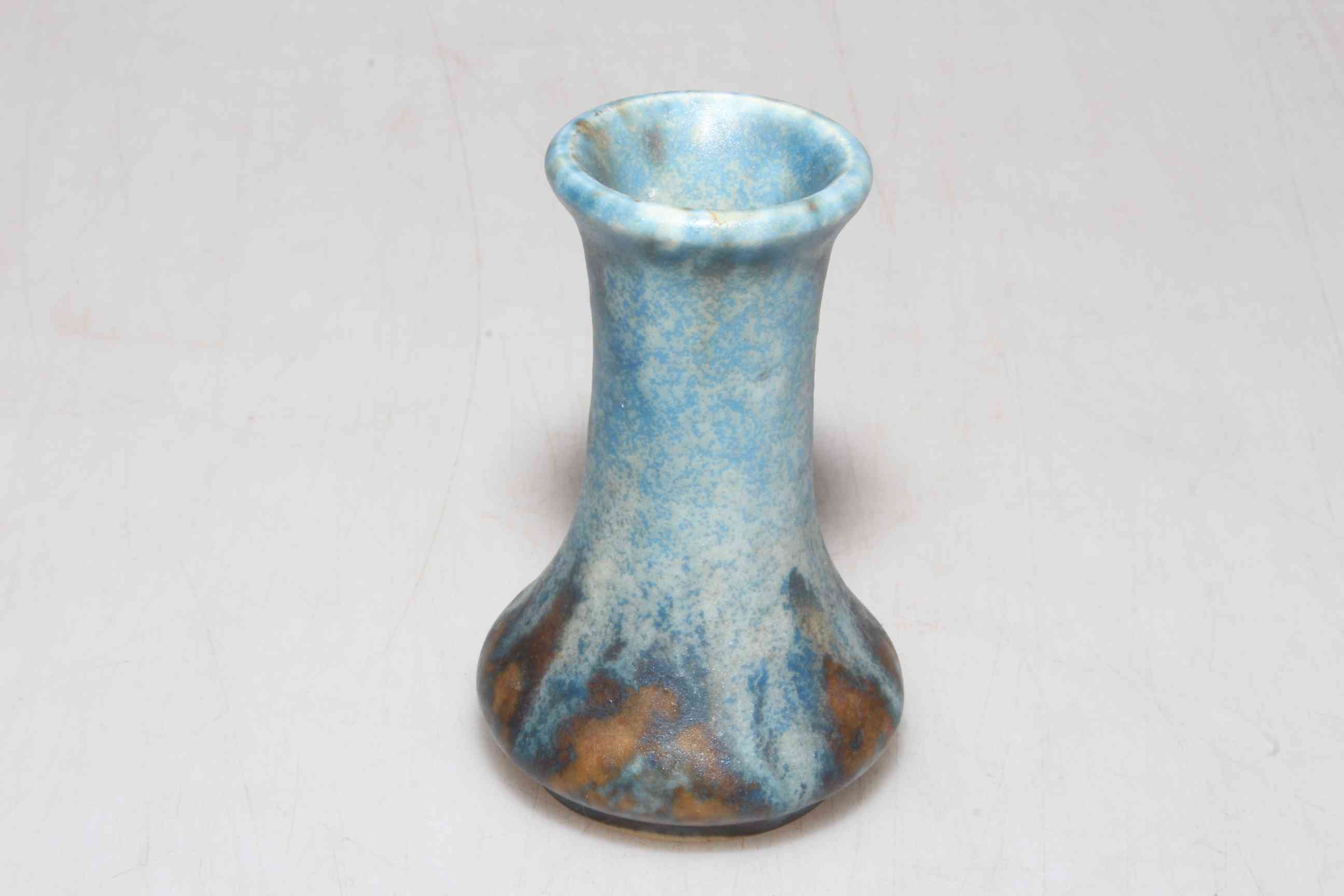 Miniature Ruskin Ware blue ground vase, 8cm high.