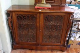 Victorian rosewood serpentine front chiffonier having two fretwork and glazed panel doors,