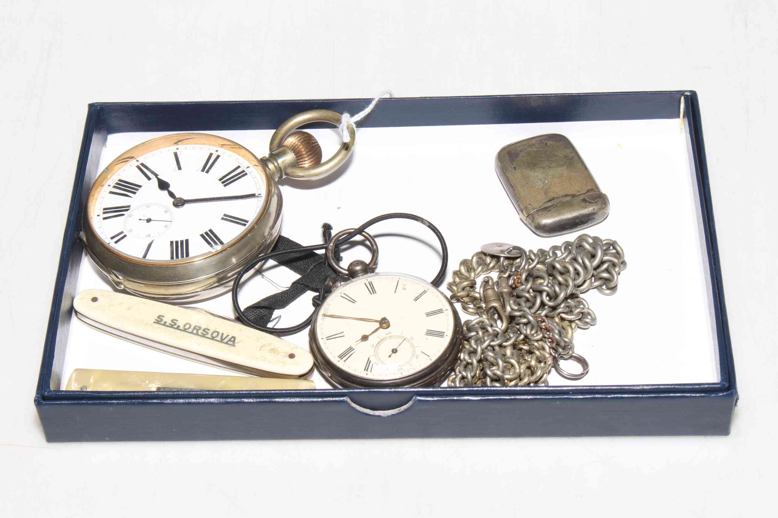 Large pocket watch, smaller silver pocket watch, albert chains, vesta and two pocket knives.