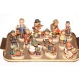 Collection of twelve Hummel figures including Puppy Love, Feeding Time,