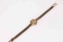 Ladies 9 carat gold Accurist wristwatch with 9 carat gold bracelet strap.