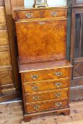 Burr walnut secretaire having two small drawers above a fall front enclosing well fitted interior