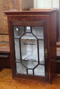 Small astragal glazed display cabinet marked Frys Chocolate, 68cm by 45cm by 23.5cm.