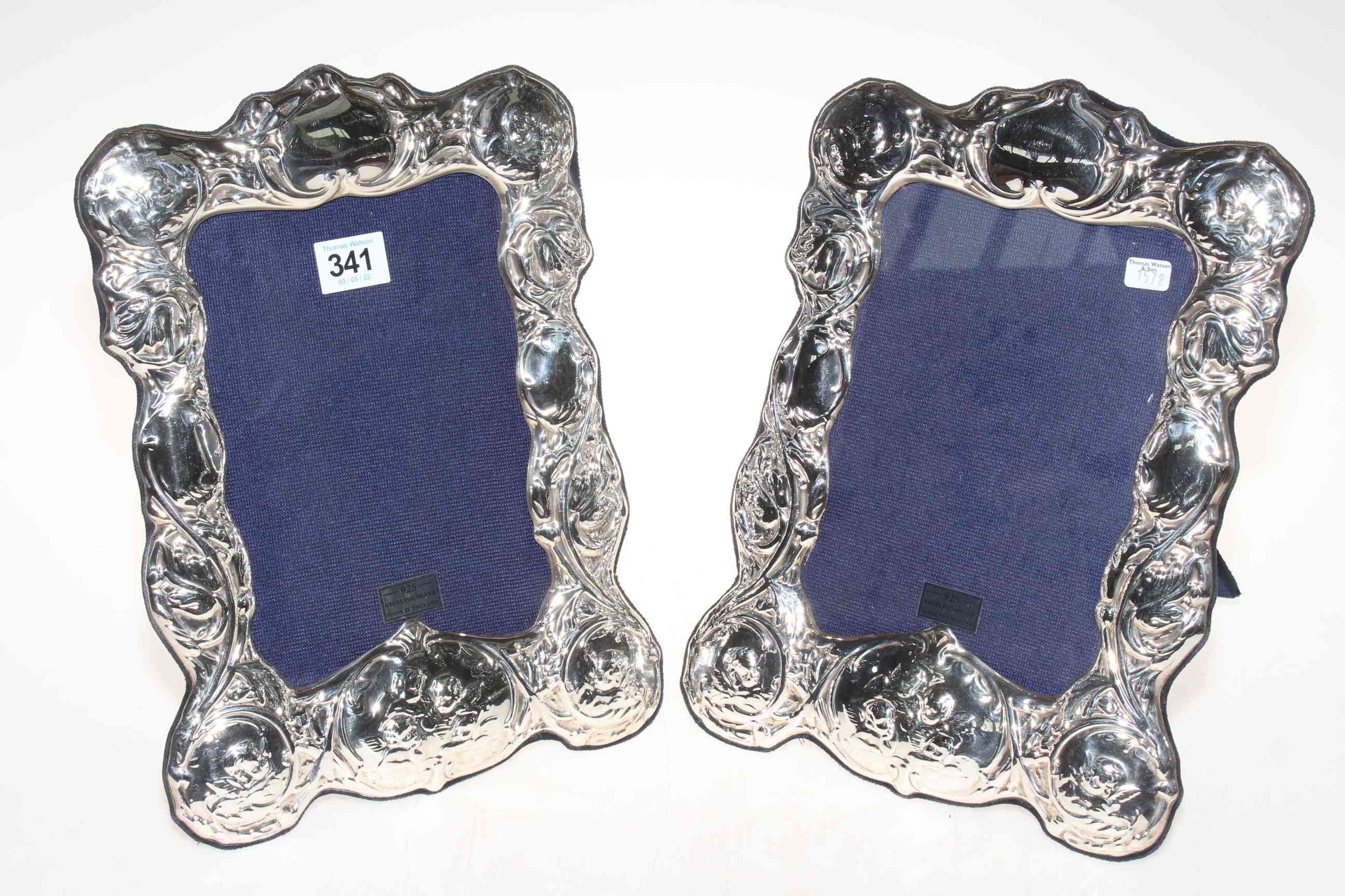 Pair of floral embossed Sterling silver photograph frames, image size 8x6 inches.