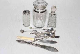 Three silver topped toilet bottle, set of six silver coffee spoons and silver cutlery.