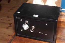 Metal safe with key, 31cm by 20cm.