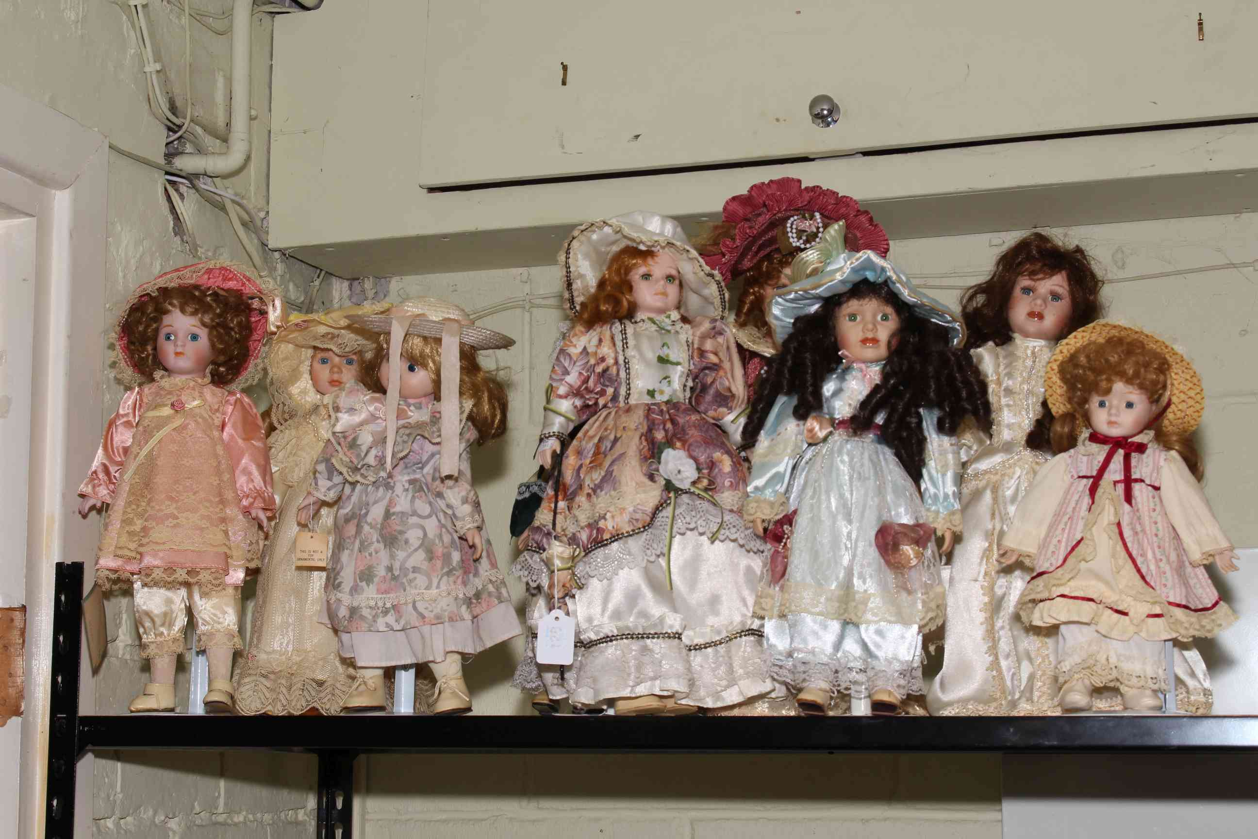 Nine dressed dolls.