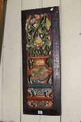 Chinese carved wood plaque depicting a vase of flowers, 73cm by 27cm.