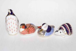 Four Royal Crown Derby paperweights including Duck, Pheasant, Penguin and Hedgehog.