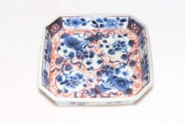 Chinese blue and white and iron red square form stand, 14.5cm across.