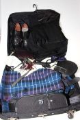 Travel case containing kilt and accessories.