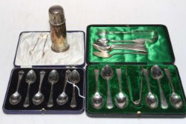 Two cased sets of silver teaspoons, other silver teaspoons and tongs, and caster.