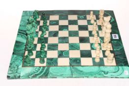 Malachite and marble chess set with board.