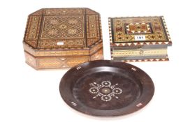 Two inlaid wooden boxes and a mother of pearl inlaid plate (3).