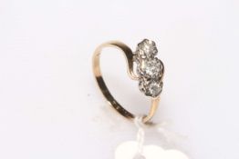 Three stone diamond and 9 carat gold ring, size N.