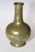 Chinese bottle vase decorated with gilt butterflies on green ground, gilt mark, 21cm.