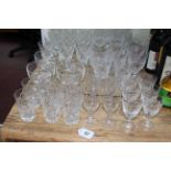 Collection of cut glass including wine and tumblers.