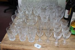 Collection of cut glass including wine and tumblers.