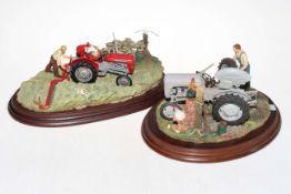 Two Country Artists resin tractor models.