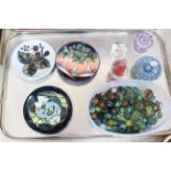 Millefiori and other glass paperweights, tub of marbles and three Moorcroft pin trays.