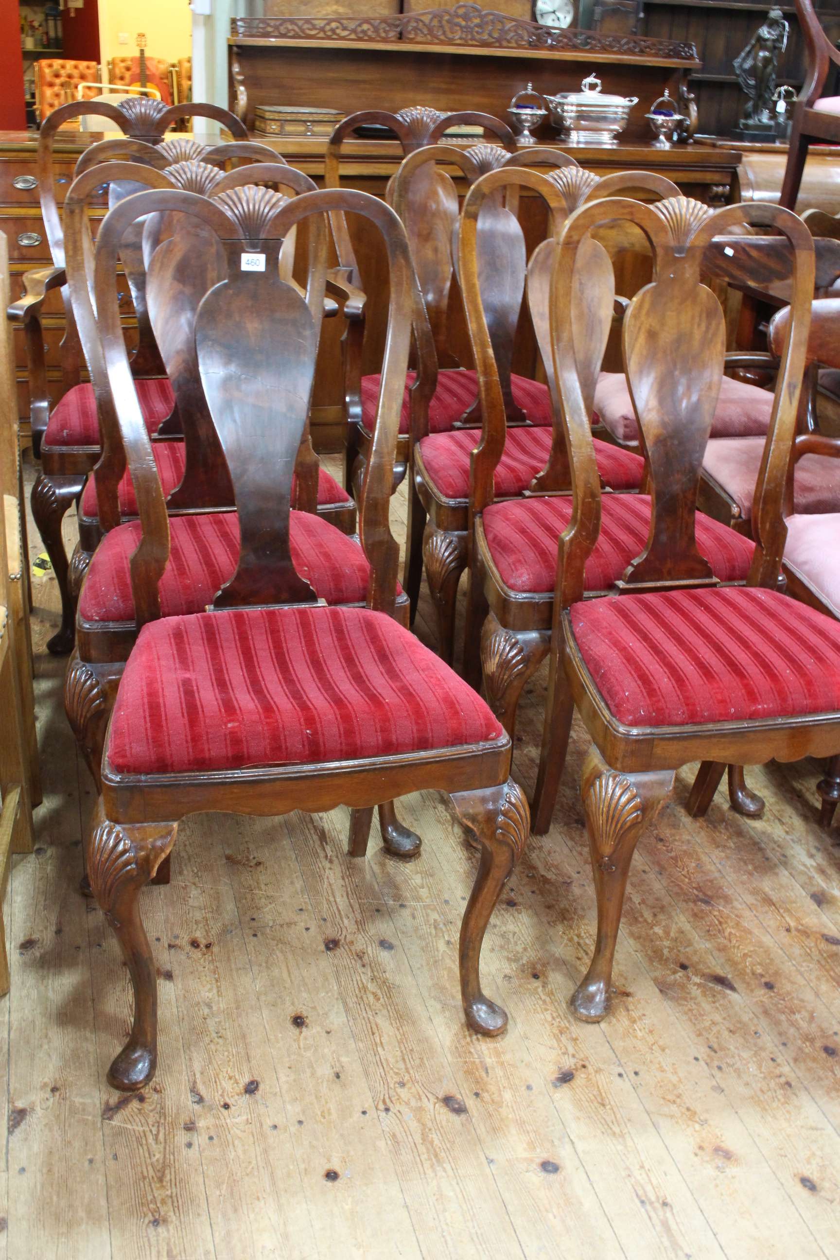 Set of eight walnut Queen Anne style dining chairs including pair carvers.