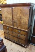 Antique mahogany secretaire press having two doors enclosing well fitted interior above two short