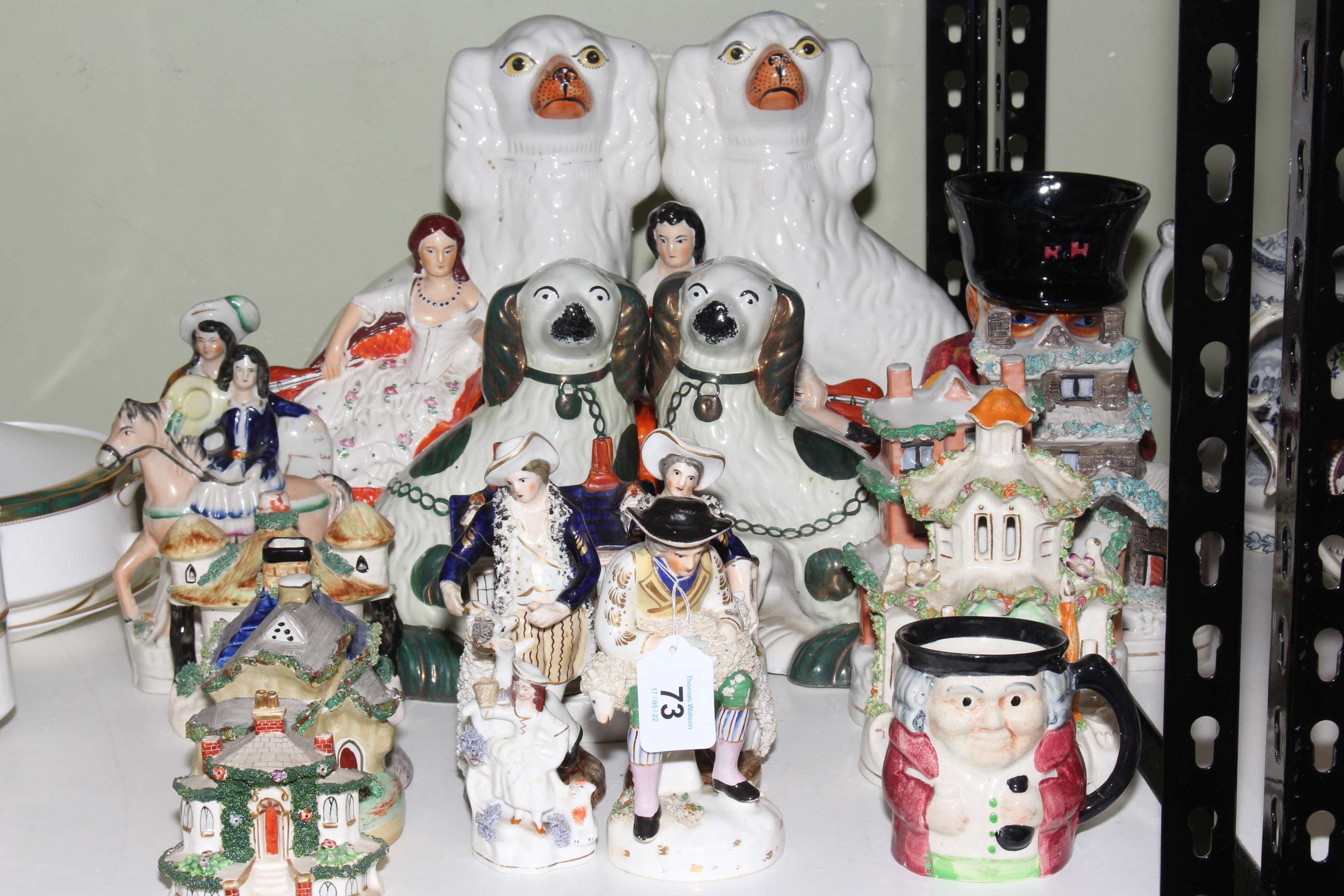Collection of Staffordshire including dogs, cottages, flatbacks, character jugs, etc.