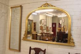 Gilt framed overmantel mirror and rectangular gilt framed bevelled wall mirror.