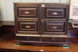 Indian rosewood and brass mounted table cabinet having two doors enclosing six drawers and