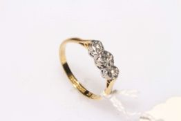 Three stone diamond ring set in platinum and 18 carat gold, size N.