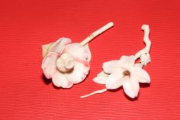 Two Japanese ivory flowers, 9.5cm length.