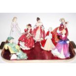 Seven Royal Doulton figures including Southern Belle and Ascot.