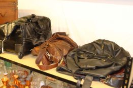 Four luggage or weekend bags including soft leather.