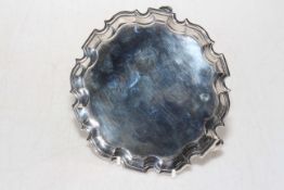 Georgian silver card tray with Chippendale border, London 1735, 16cm diameter.