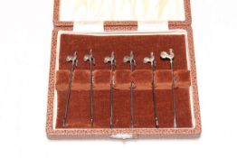 Cased set of six silver cocktail sticks.