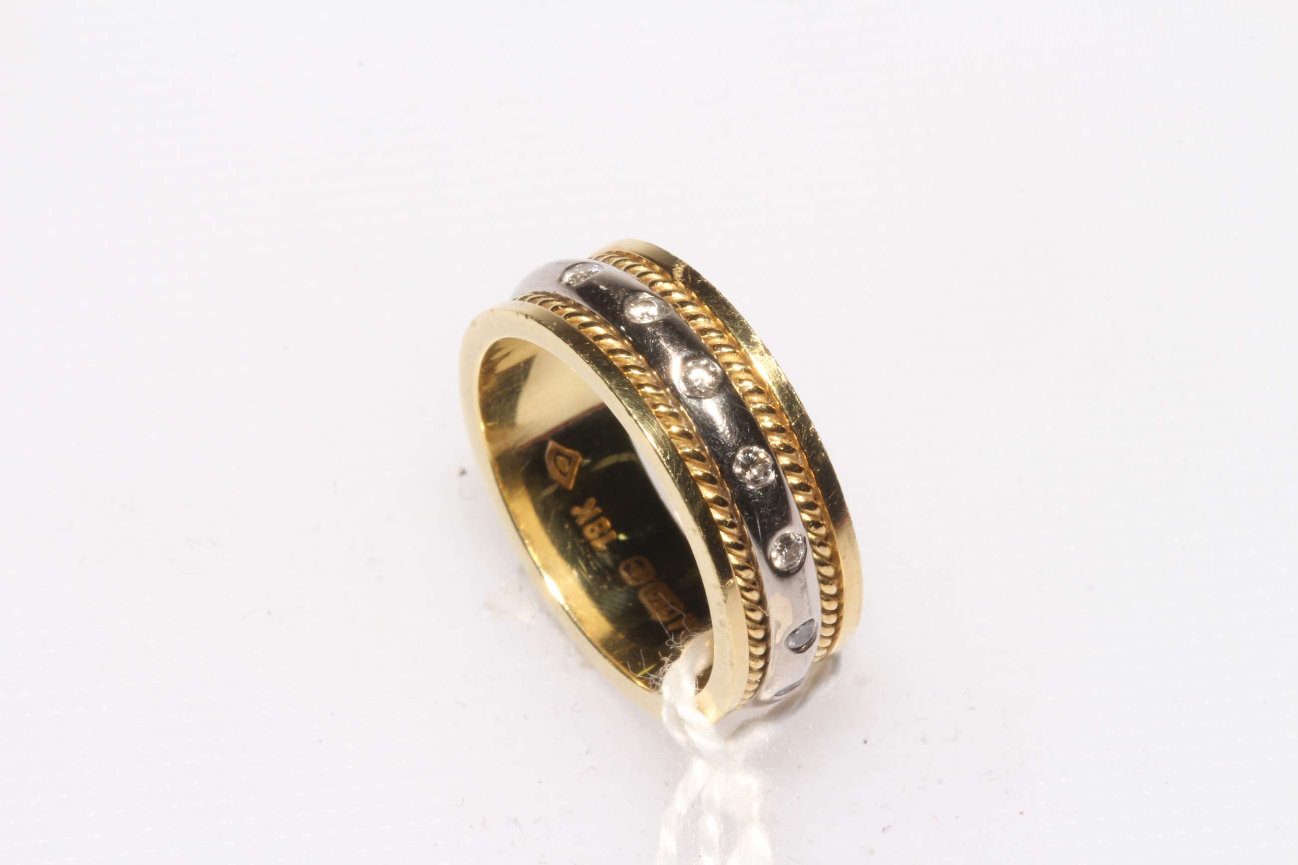 Diamond set yellow and white 18 carat gold ring, size I.