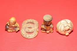 Two antique ivory netsuke, figure fob, and interlocking circles (4).